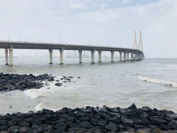 View of bridge over sea against sky