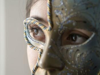 Close-up portrait of woman wearing mask