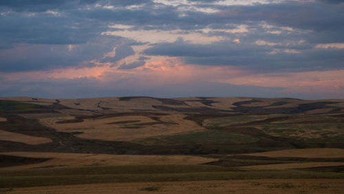 Scenic view of landscape against sky during sunset