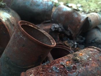 Close-up of rusty stack on rock