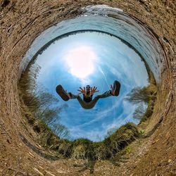 High angle portrait of man reflection in water