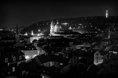High angle view of illuminated buildings in city at night
