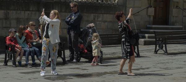 People standing in shopping cart