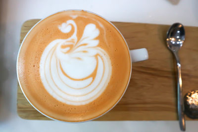 Close-up of cappuccino on table