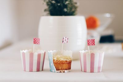 Flags on cupcakes at table