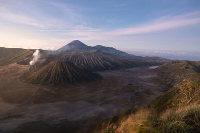 View of volcanic landscape against cloudy sky