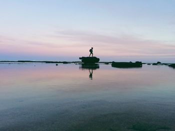Scenic view of sea at sunset