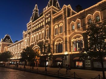 Group of people in illuminated building at night