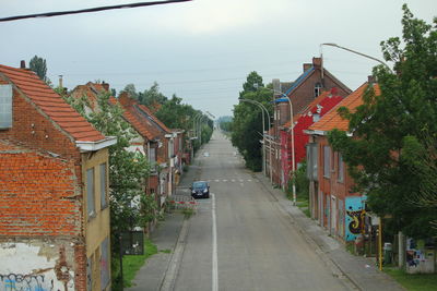 Street amidst buildings against sky