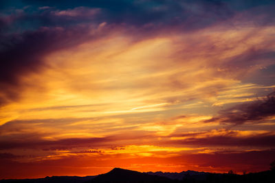 Low angle view of dramatic sky during sunset