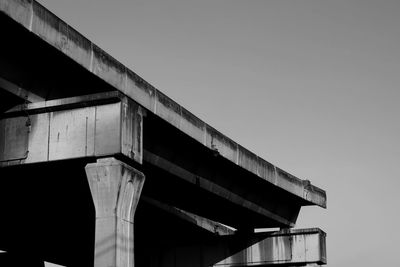 Low angle view of elevated road against clear sky