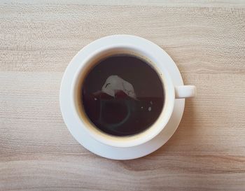 High angle view of coffee cup on table
