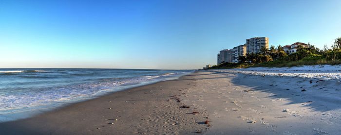 Scenic view of beach against clear sky