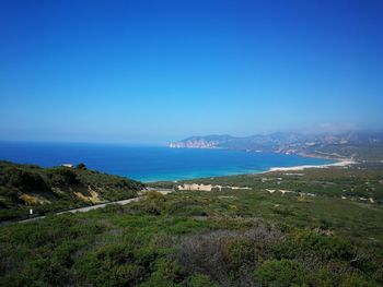 Scenic view of sea against clear blue sky