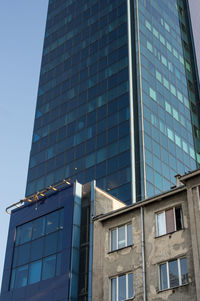 Low angle view of office building against sky