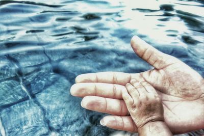 Low section of man legs on water