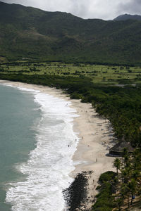 High angle view of tourists on beach