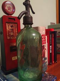 Close-up of old bottles on table