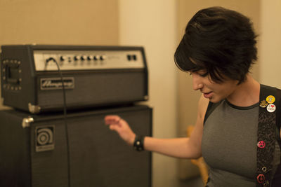 Portrait of a young musician in a rehearsal space