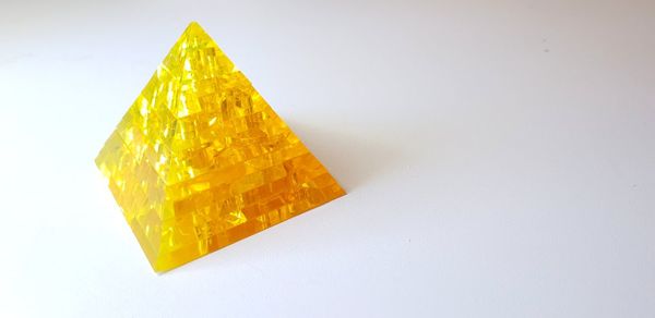 High angle view of yellow leaf on white background