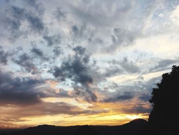 Low angle view of dramatic sky during sunset