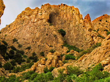 Low angle view of rock formation against sky