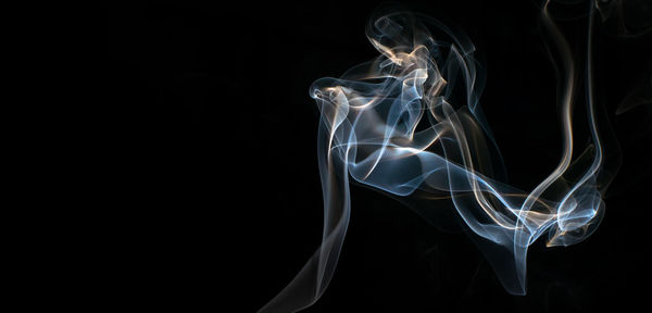 Close-up of smoke against black background