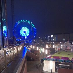 Illuminated carousel in amusement park