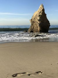 Rocks on beach against sky in el matador beach malibu 