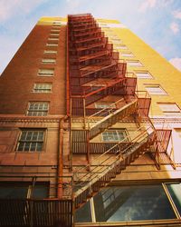 Low angle view of staircase in city against sky