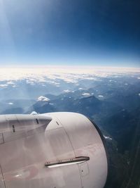 Aerial view of aircraft wing against sky