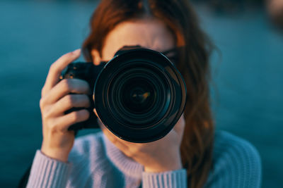 Close-up of woman photographing