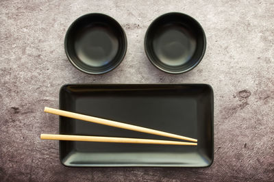 High angle view of chopsticks on table