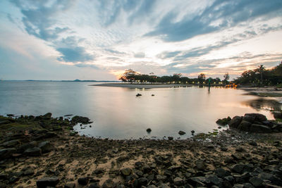 Idyllic view of sea against sky during sunrise