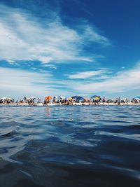 Scenic view of sea against blue sky