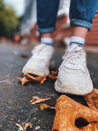 Low section of man walking on footpath