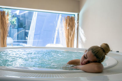 Woman relaxing in swimming pool