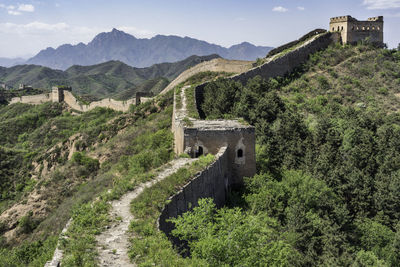 Castle on mountain against sky