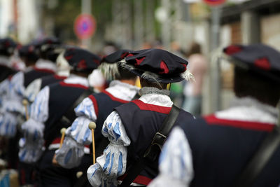 Rear view of musician walking in a row