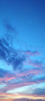 Low angle view of dramatic sky during sunset