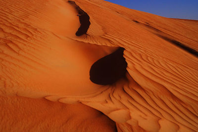 Low angle view of desert against sky