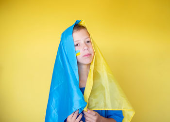 Close-up of clothes hanging against white background