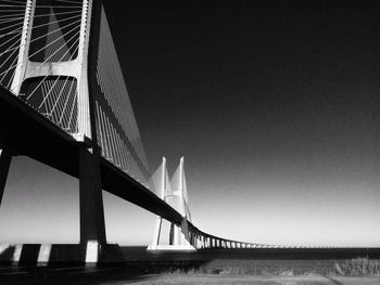 Low angle view of vasco da gama bridge against sky