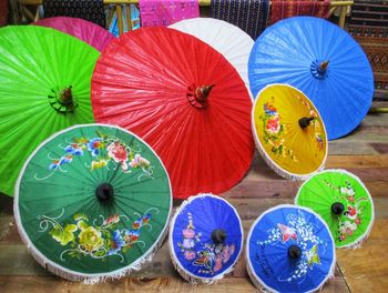 High angle view of multi colored umbrellas on table