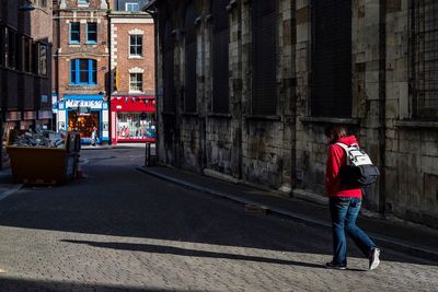 People walking on street in city