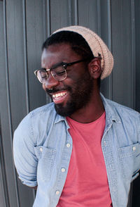 Portrait of smiling young man standing outdoors