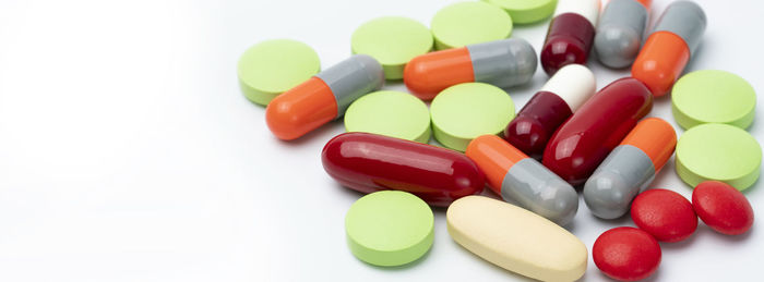 Close-up of pills on white background