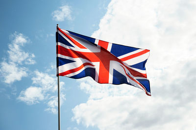 Low angle view of flag against sky