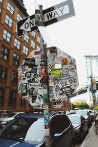 Close-up of road signs in city