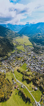 Aerial view of landscape and buildings against sky